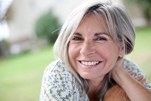 a patient with dental implants smiling