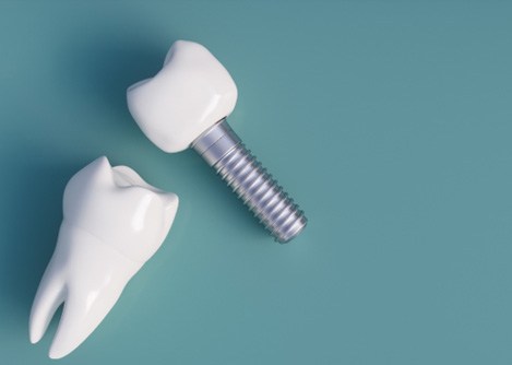 a closeup of dental implants against a green background