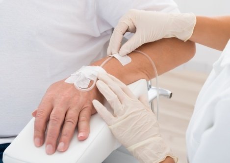 Close up of patient getting I V placed in their arm for sedation dentistry in Worcester