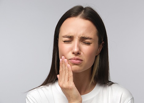 a patient dealing with dental pain