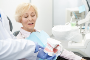 a patient chatting with their dentist about dental implants 